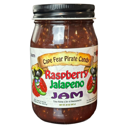A glass jar of Cape Fear Pirate Candy Raspberry Jalapeño Jam with a black metal lid and a colorful label, shown against a plain white background.